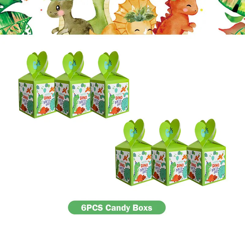 Six green cardboard boxes decorated with dinosaur themes for a birthday party kit
