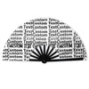 A black folding hand fan with a sunburst design showing customizable text patterns.