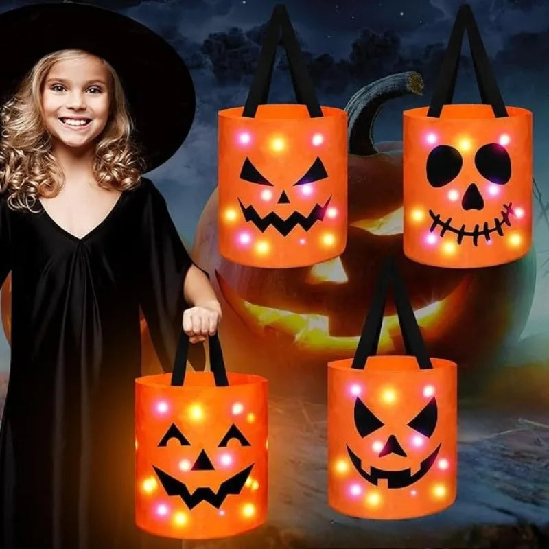 A young woman stands next to several orange pumpkin tote bags with LED light-up handles.