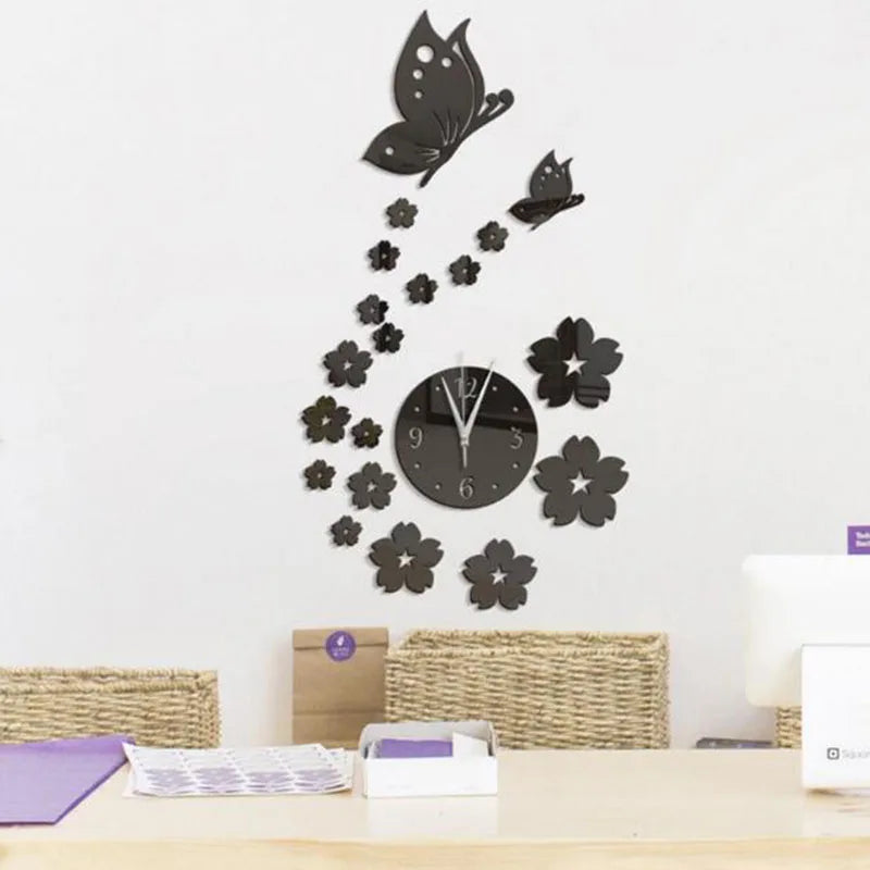 A modern acrylic wall clock featuring a black butterfly and floral design on a white background.