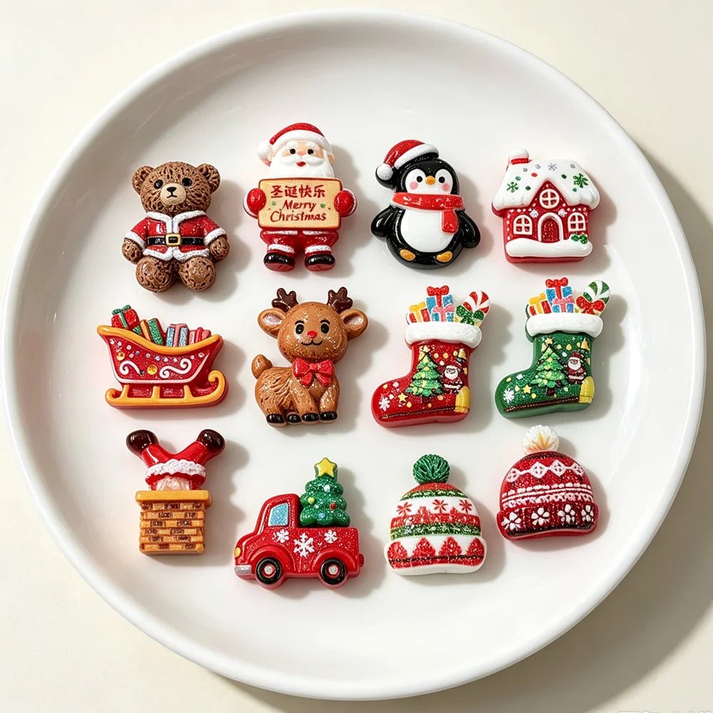 Assorted Christmas resin cabochons including a teddy bear, Santa, reindeer, house, and truck for DIY crafts