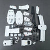 A collection of white V-22 Osprey tiltrotor building blocks and components scattered on a dark gray surface.