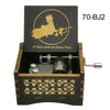 A wooden music box featuring a gold-colored silhouette of a figure with a fan, labeled 70-BJ2.