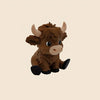 A small, brown Highland cow statue with horns and black hooves.