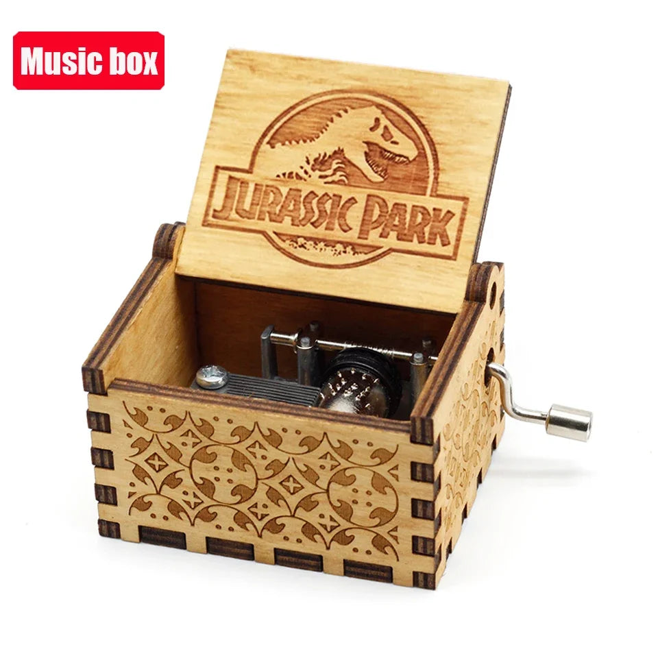 A carved wooden Jurassic Park music box with an open lid showing a small metal mechanism inside.