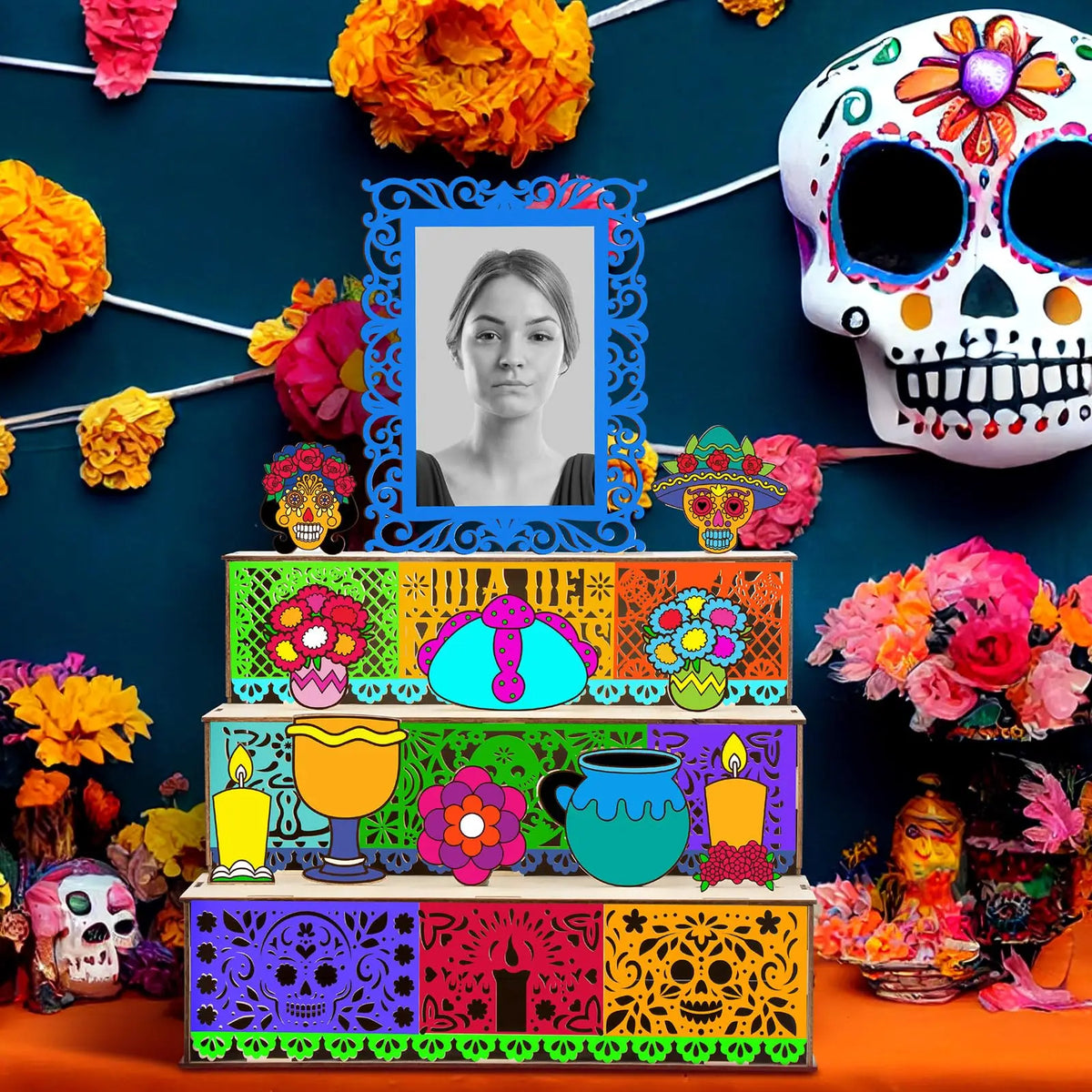 A wooden memory box for Día de los Muertos featuring a photo display and colorful floral decorations.