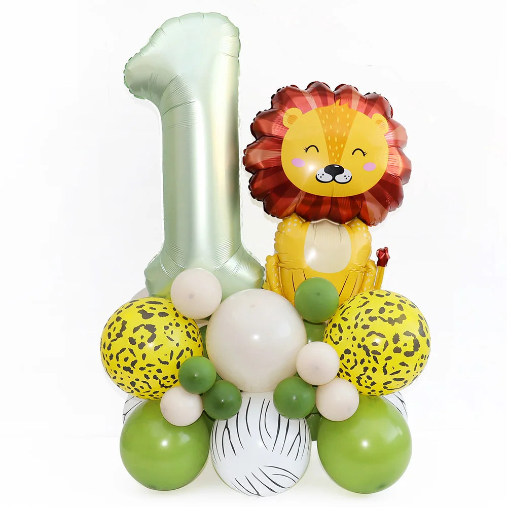 Jungle safari birthday party tableware set featuring a large number one balloon and a lion-themed decoration with various col