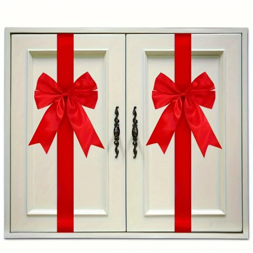 Pair of white cabinet doors decorated with red ribbon bows.