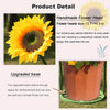 Handmade flower head of a bright yellow sunflower with a dark center displayed next to an upgraded metal pot.
