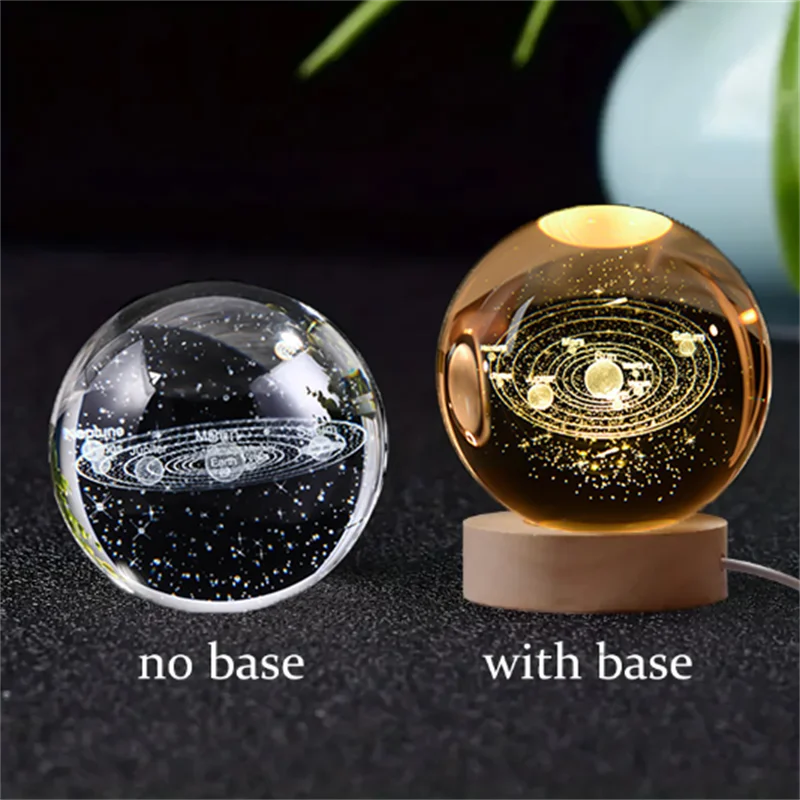 A comparison of a 3D crystal ball night light without a base and with a wooden base.