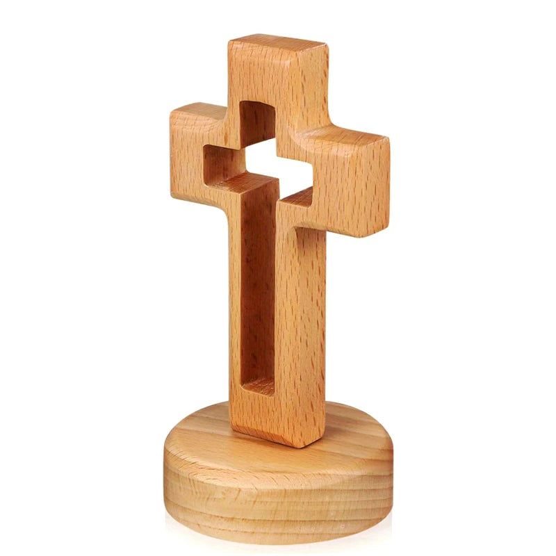 Handcrafted wooden cross standing ornament made of light-colored wood.