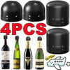 Four black reusable silicone wine bottle stoppers with rotating locks and a cartoon airplane.