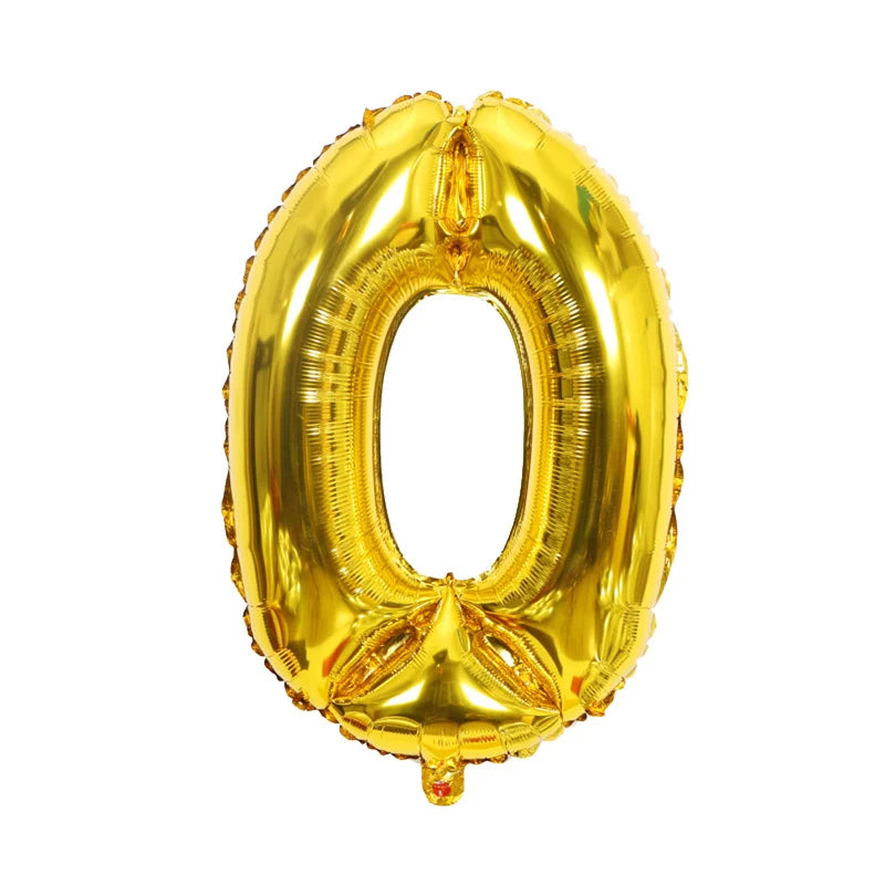 A shiny gold foil number balloon shaped like the digit zero.