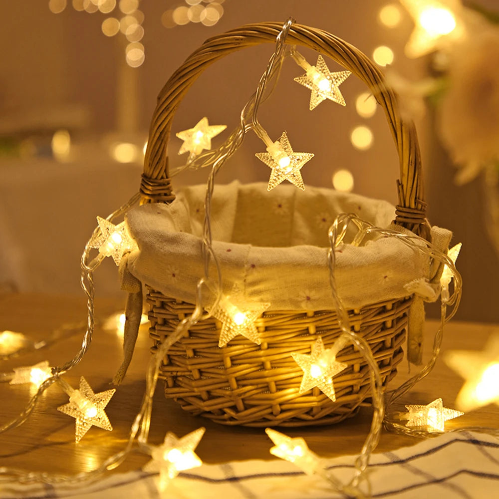 A woven basket filled with LED star fairy lights illuminating a warm, soft background.