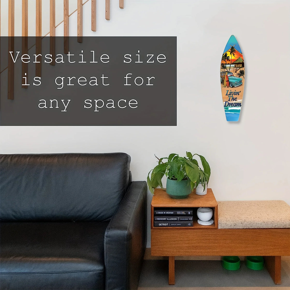 A vertical wooden tiki bar sign with tropical imagery hangs on a white wall next to a dark leather sofa.