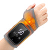 A hand wearing a heated wrist massager device with orange glowing therapy points.