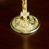 Elegant gold metal Jesus cross ornament with a decorative base for home or church