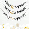 Elegant black and gold glitter birthday banner with happy birthday text strung across the frame