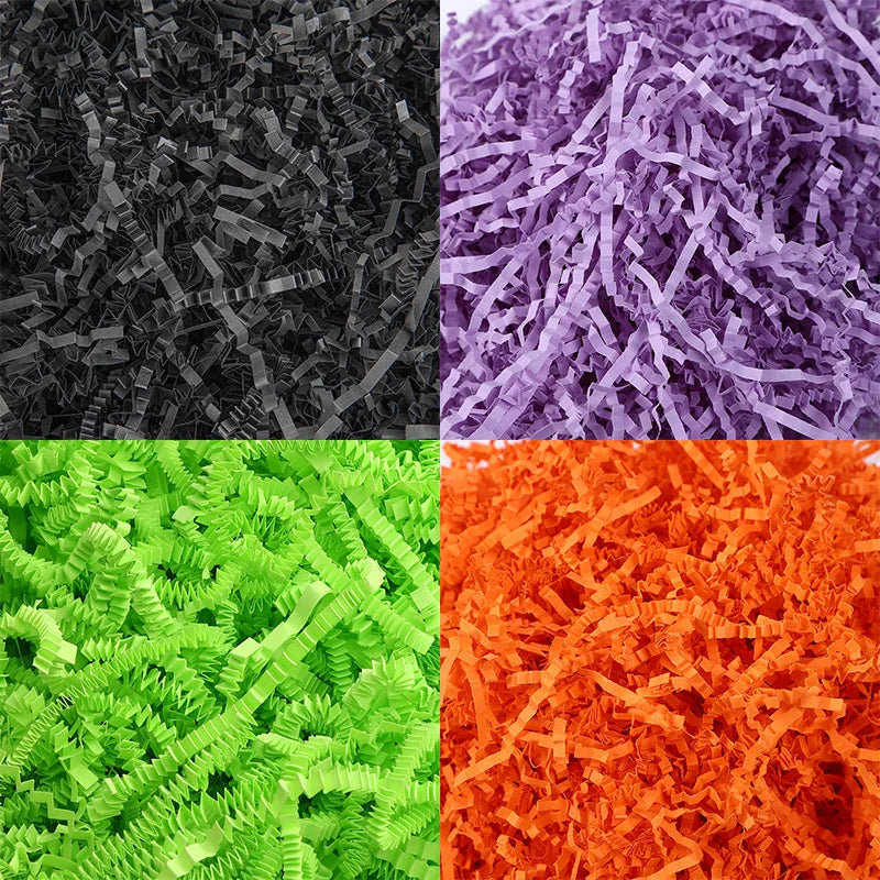 A square image showing three colors of crinkle paper shred filler: black, purple, and orange.