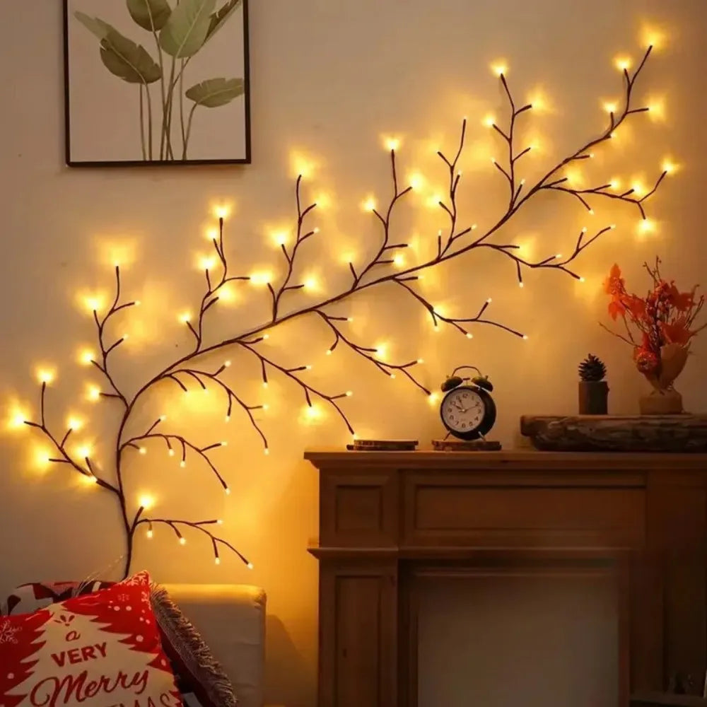 A decorative willow branch string light display mounted on a wooden cabinet.