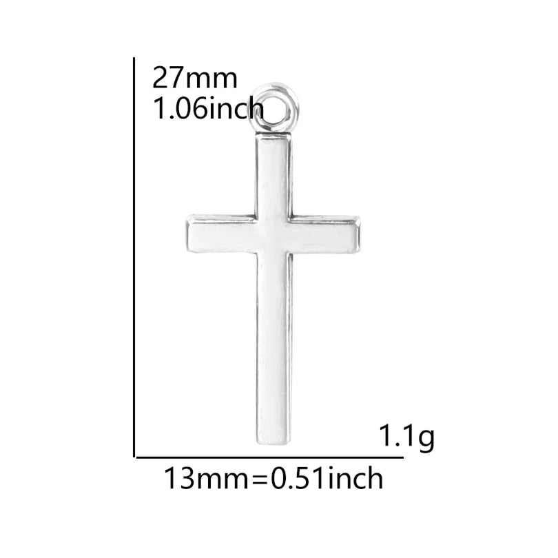 A silver cross charm with dimensions 27mm long and weighs 1.1 grams.