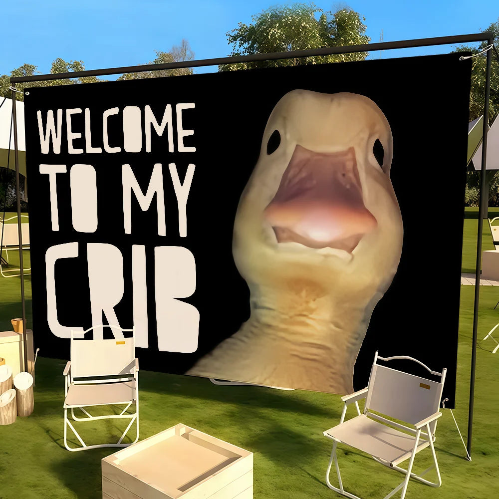 A large banner featuring a realistic duck face saying Welcome to My Crib, displayed outdoors on a green lawn.