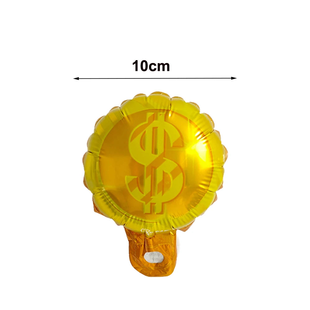 A golden foil balloon shaped like a casino dice, used for Las Vegas party decor.