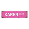 A distressed pink metal tin sign with the text KAREN LANE.