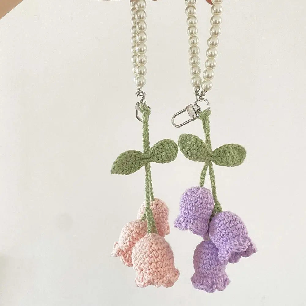 Handmade pearl chain orchid key ring featuring light green and purple fabric flowers