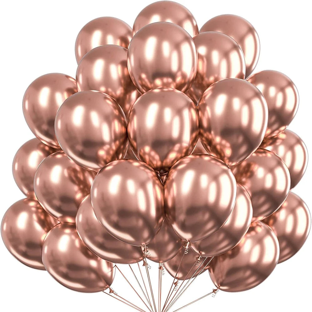 Un amas de ballons métalliques rose et or rose.