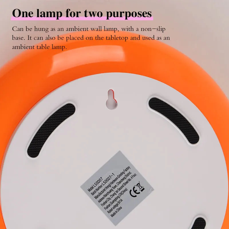 Orangefarbene und weiße, donzenförmige, wiederaufladbare Wandlampe mit Lichtöffnung.