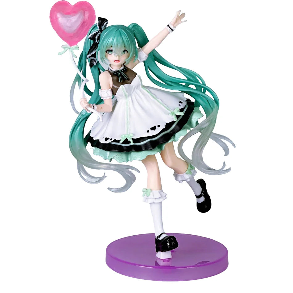 A PVC collectible figurine of Hatsune Miku with teal hair, a white dress, and pink heart accessories.