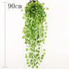 A long, cascading artificial plant vine wall hanging with bright green leaves.
