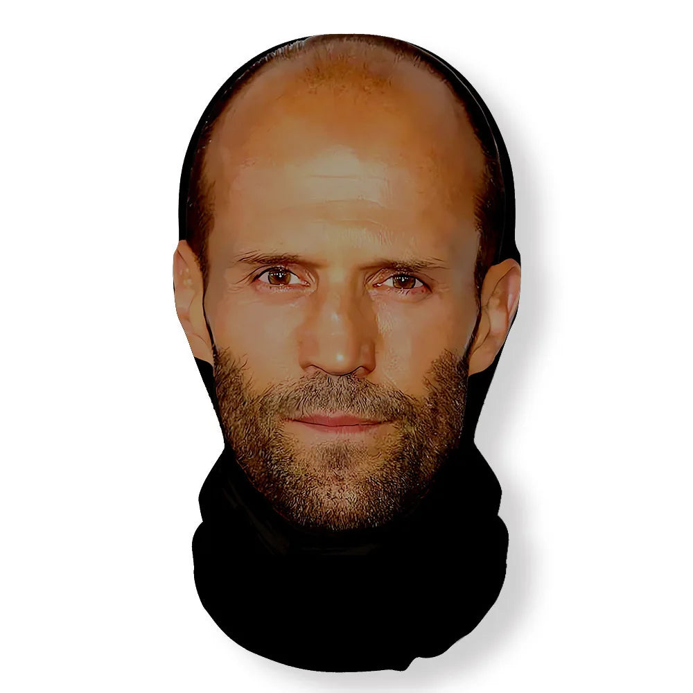 A portrait of a man with short hair and a beard wearing a black turtleneck, looking directly at the camera.