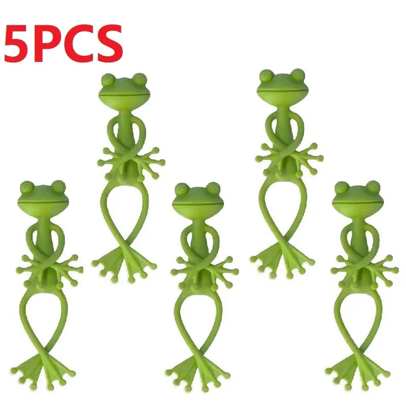 Five bright green frog-shaped plant support clips for gardening and climbing plants