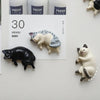 A set of six fridge magnets featuring various cat designs, including a white tabby cat and a black cat.