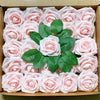 A box filled with pink and white lifelike foam roses for wedding and home décor.