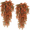 A vertical arrangement of artificial eucalyptus leaves in shades of orange and brown for home decor.