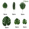 Various sizes of artificial tropical palm leaves in green, including 2, 3, and 17 pieces.