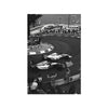 Black and white photo of a vintage Formula Grand Prix race on a track with spectators and cars.