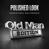 A silver-toned Old Man edition emblem with the text EDITION displayed on a dark background.