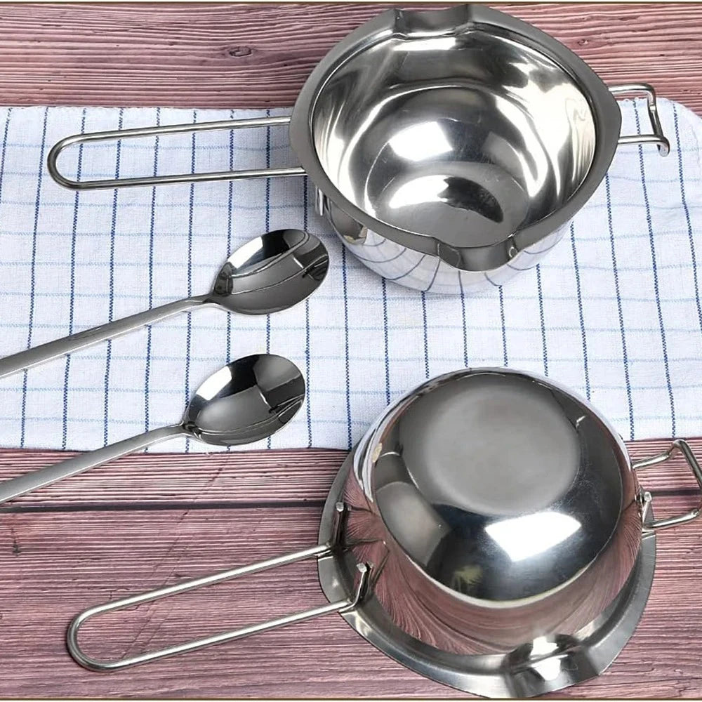 A complete candle making kit featuring a stainless steel melting pot and pouring pitcher resting on a checkered cloth.