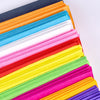 A stack of ten packs of colored crepe paper in various shades including orange, blue, pink, yellow, green, and purple.