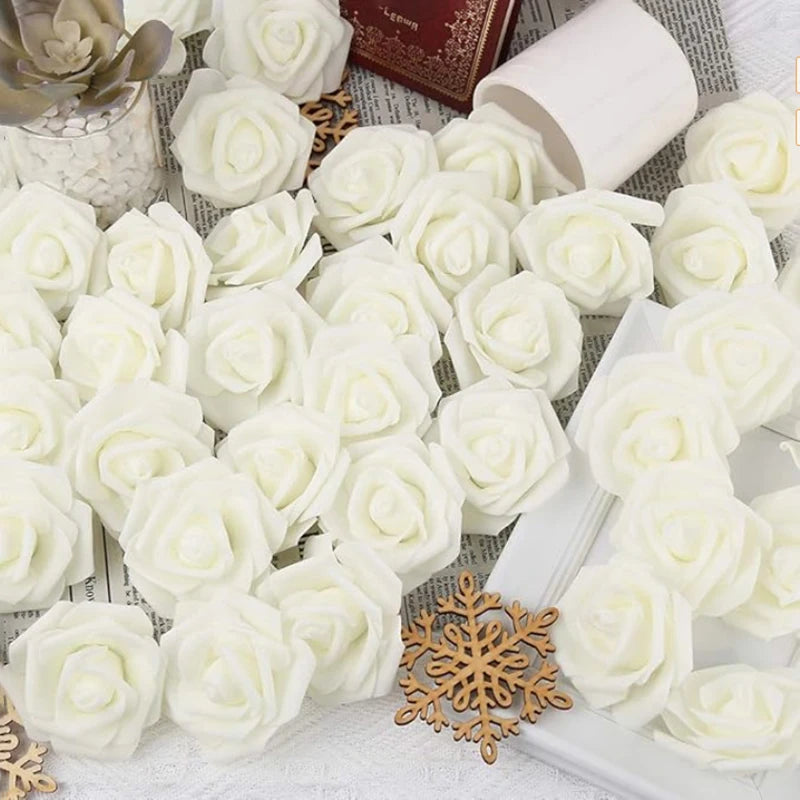 White artificial foam rose decorations arranged on a white surface.