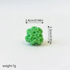 A set of three small, round, light green ocean animal cake toppers: a whale, an octopus, and a turtle.