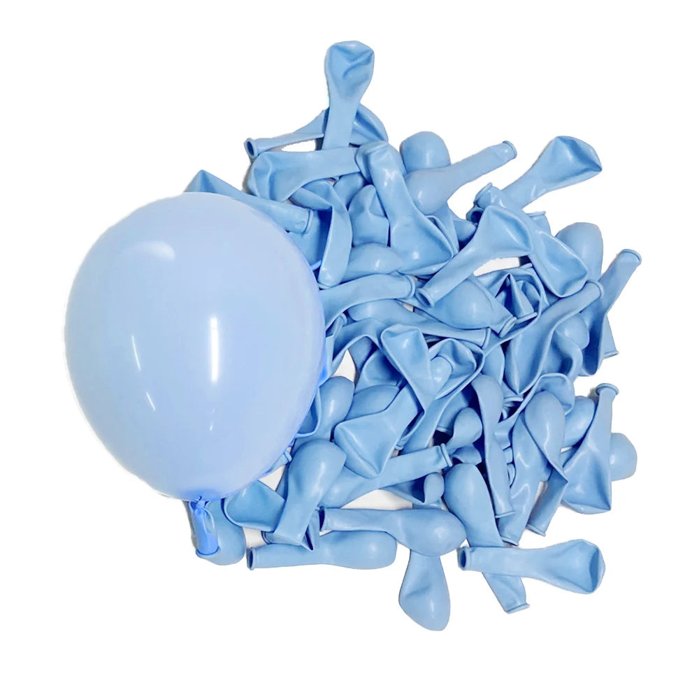 A pile of light blue latex balloons shaped like macarons for parties and celebrations.