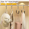 Four black and white round multi-purpose closet hooks hanging on a rod