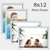 An 8x12 photo frame displaying a portrait of a man against a blurred outdoor background.