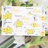 A set of inspirational star keychains featuring yellow and gold stars on white cards.