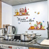 Waterproof bee butterfly wall decals displayed on a kitchen wall with appliances and wooden shelves.